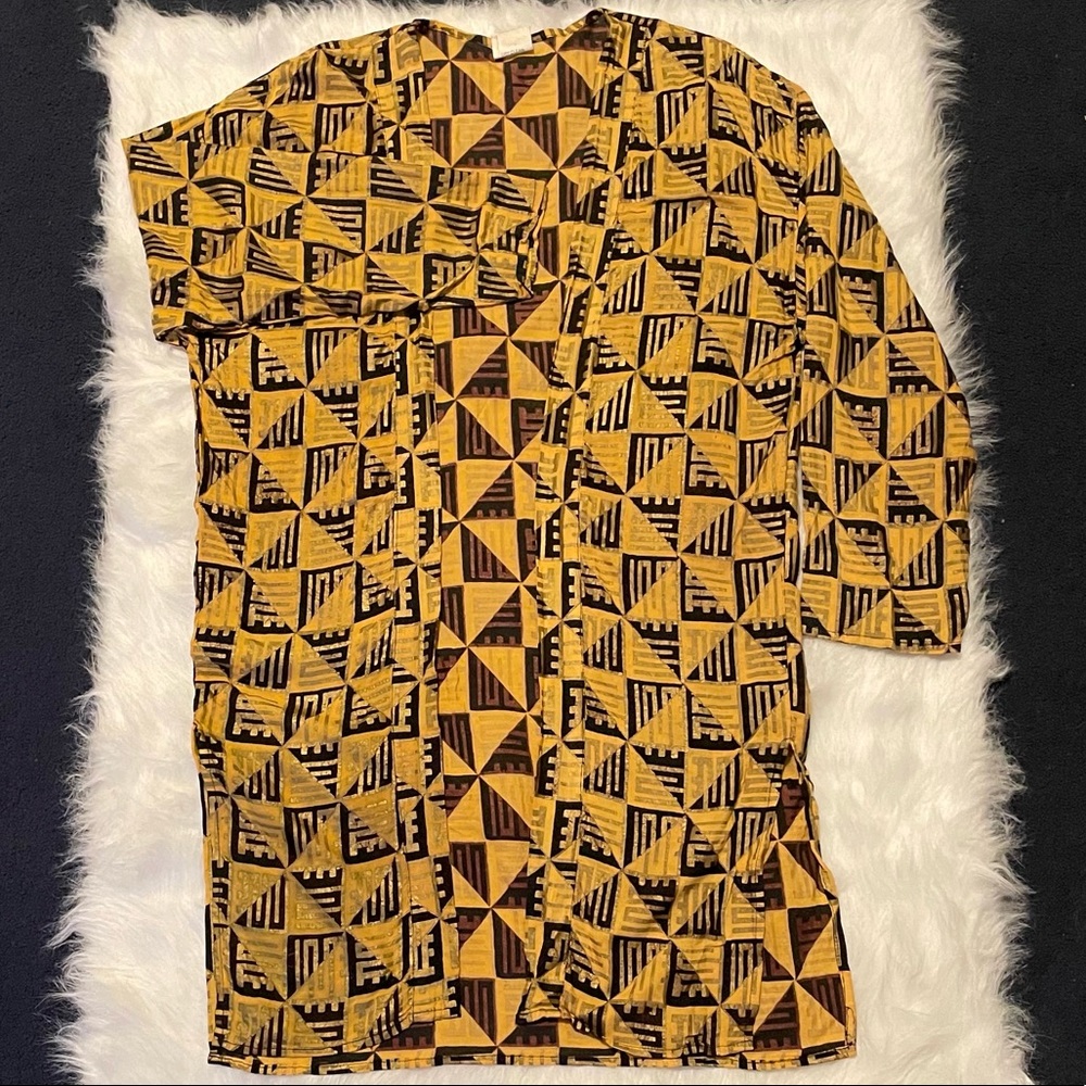 Oversized small black and gold shrug.